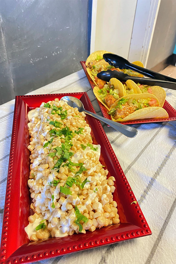 Fish tacos with red snapper and roasted “street corn” displayed for a student taste test event