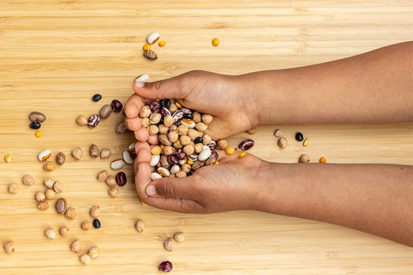 student hands holding beans